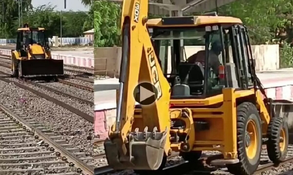 JCB on train tracks