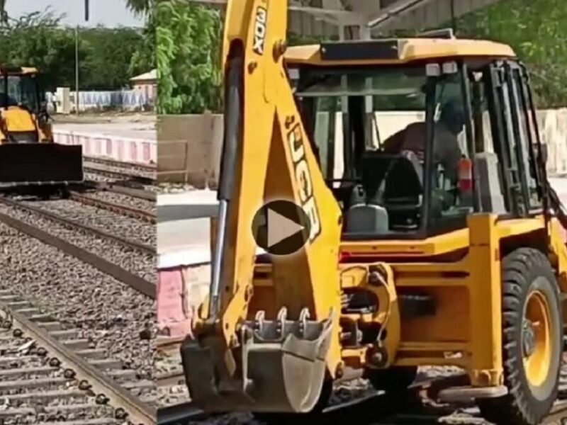 JCB on train tracks